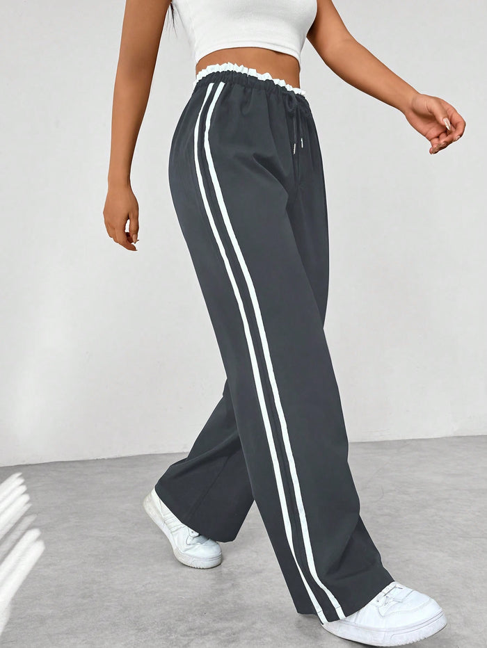 Pantalon de running femme marine à rayures contrastées