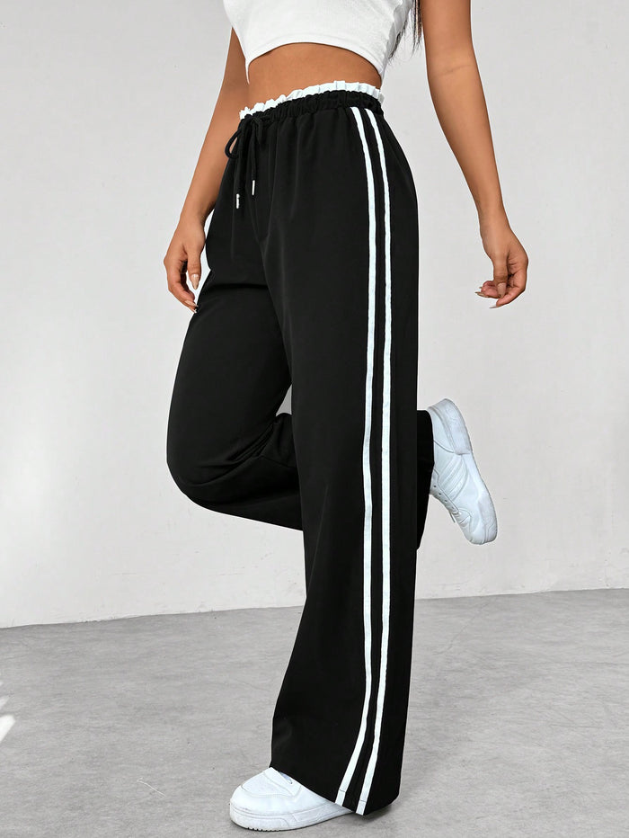 Pantalon de running femme marine à rayures contrastées